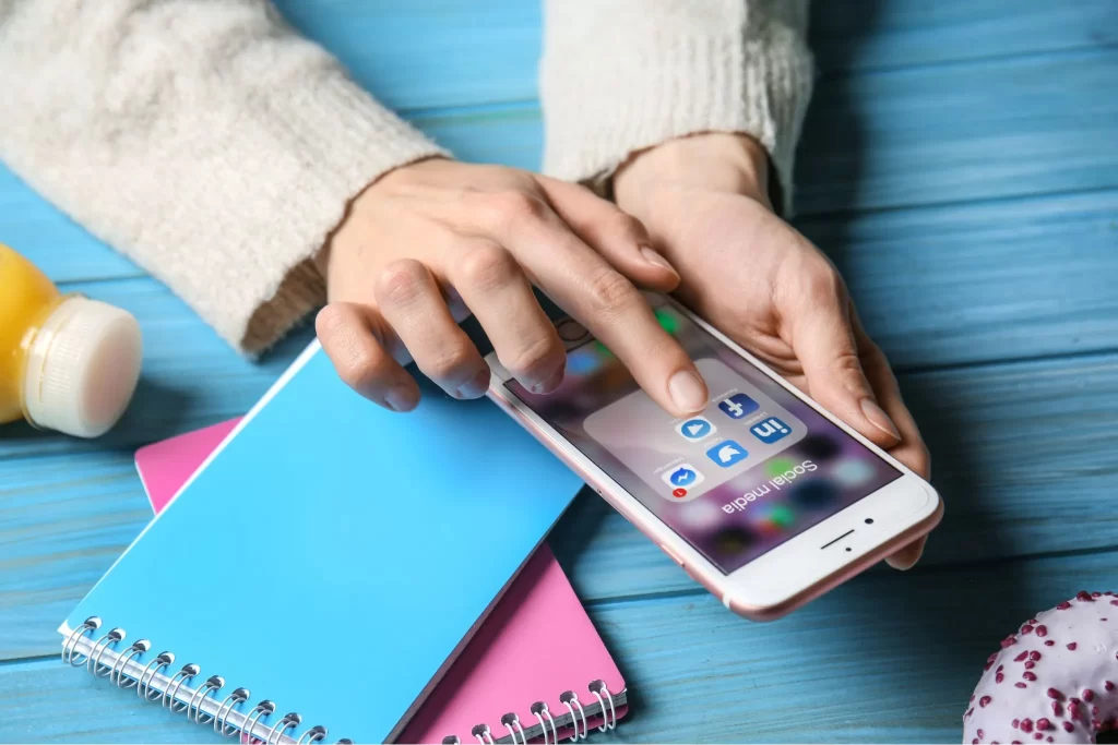 A student opening the Linkedin app on their phone